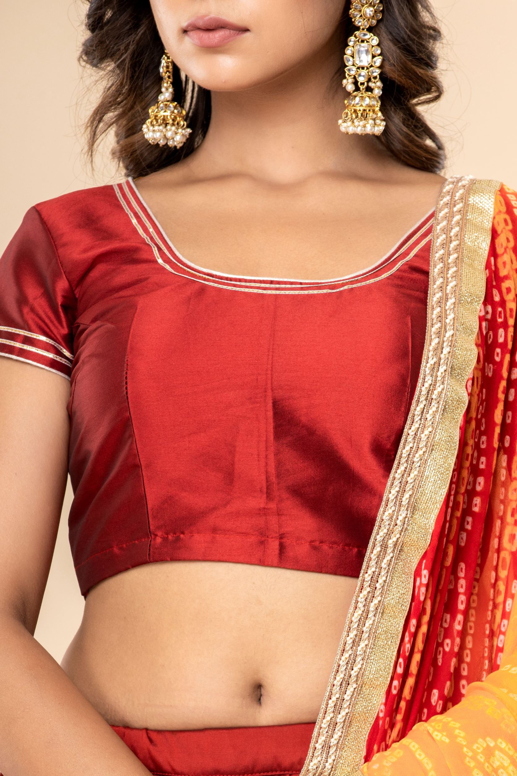 Butter Silk Lehenga And Blouse In Maroon With A Georgette Bandhani Dupatta