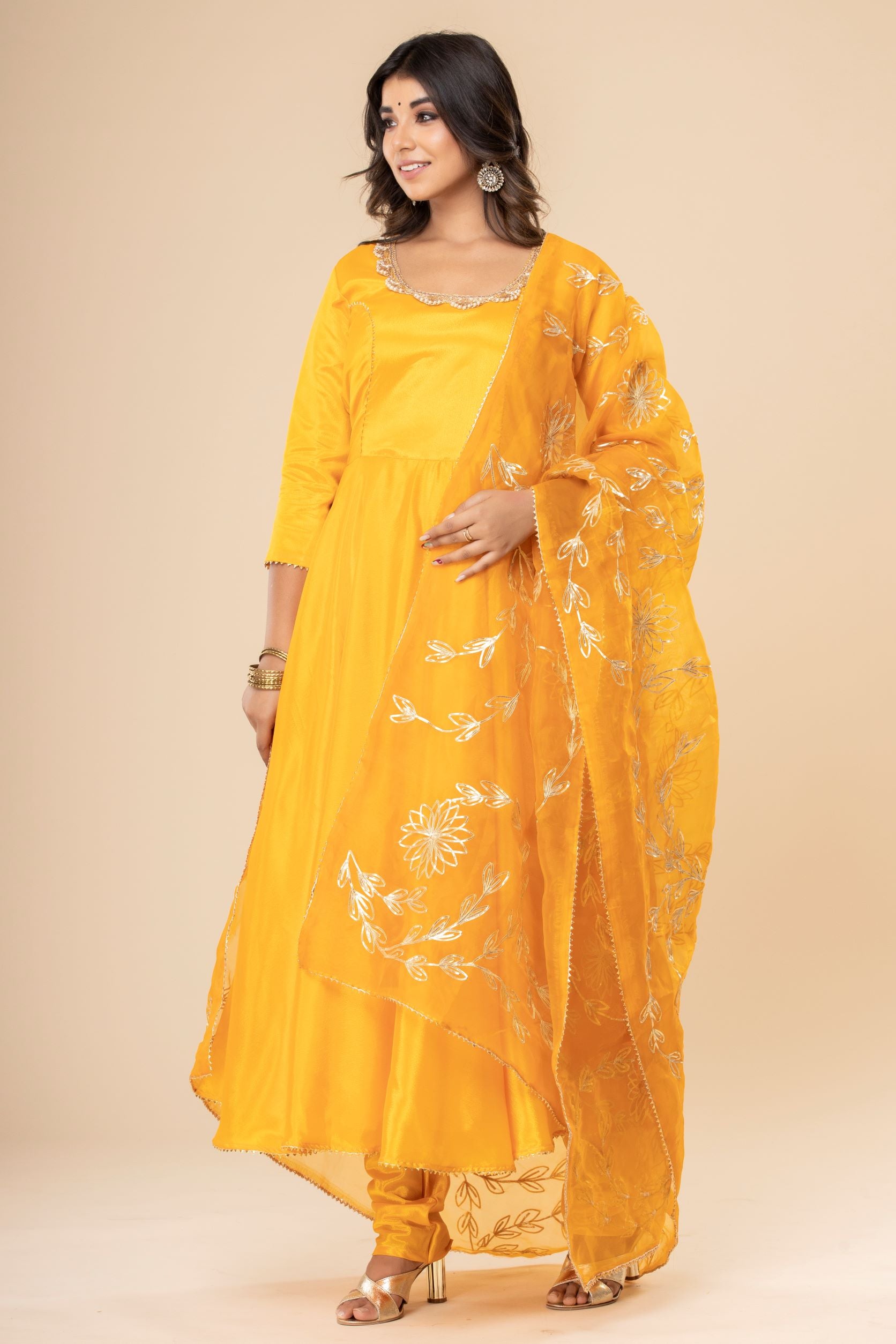 Embrace The Beauty Of Traditional Textiles With This Mustard Long Anarkali Suit